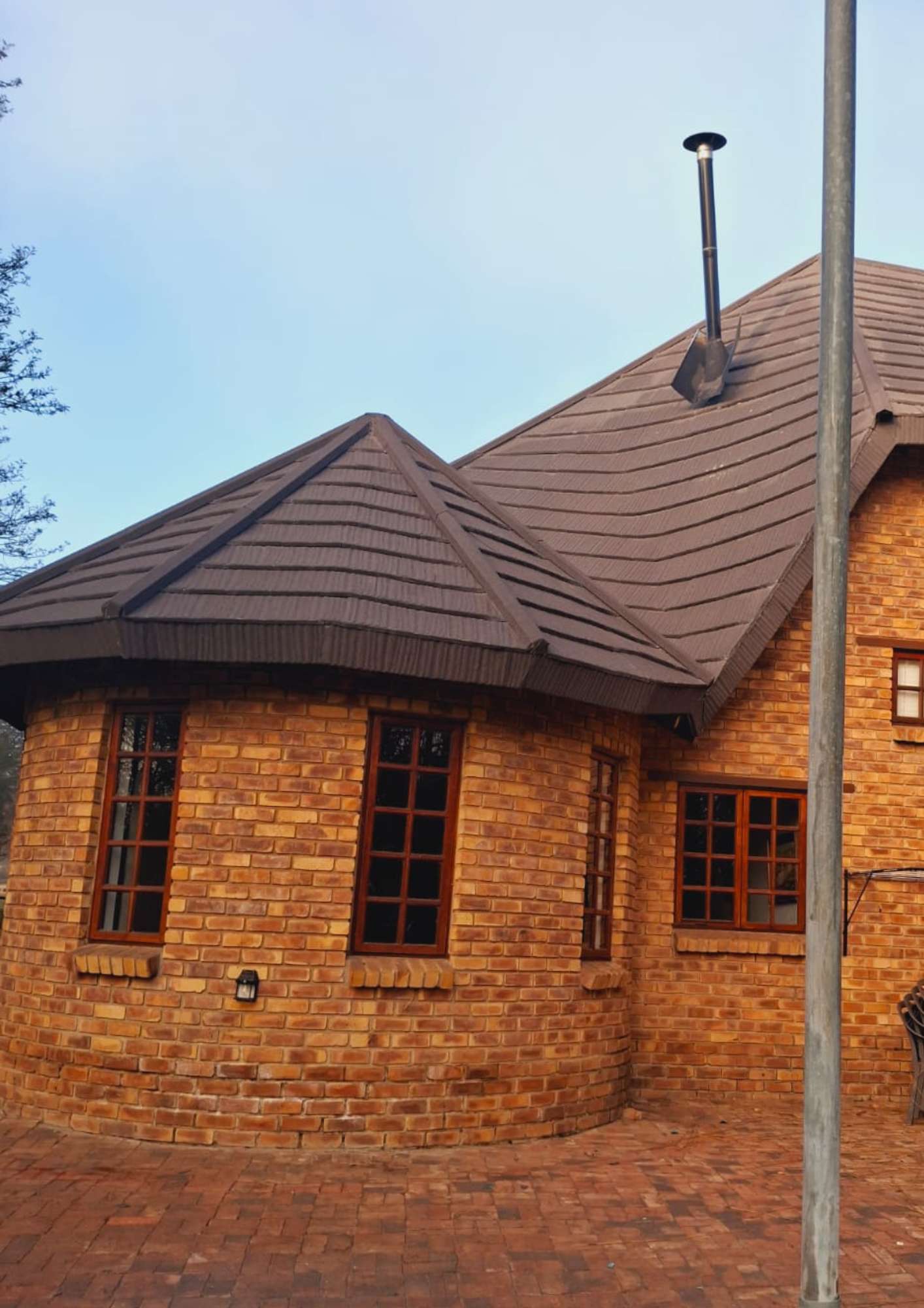 Putting final touches on thatched roof